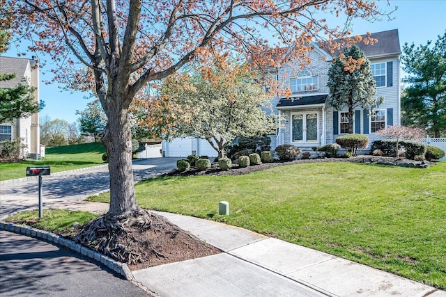 12 Carriage Dr, Piscataway, NJ 08854 - view of front of property featuring a front yard, a garage, and driveway