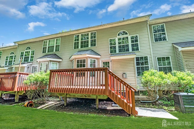 242 Hawthorne Rd, North Brunswick, NJ 08902 - rear view of property with a deck and a yard