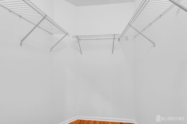 242 Hawthorne Rd, North Brunswick, NJ 08902 - spacious closet featuring wood finished floors