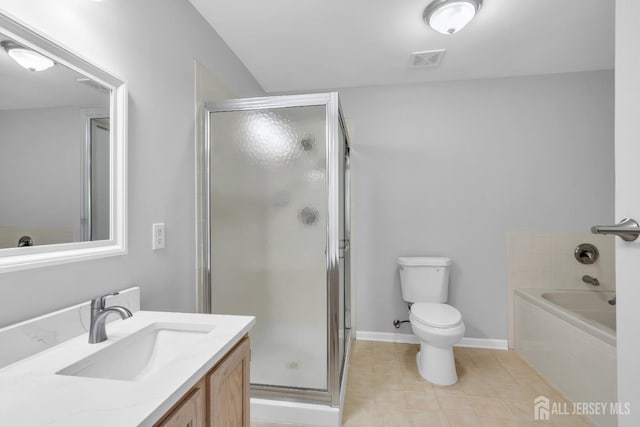 242 Hawthorne Rd, North Brunswick, NJ 08902 - full bathroom featuring vanity, a stall shower, tile patterned flooring, and a bath