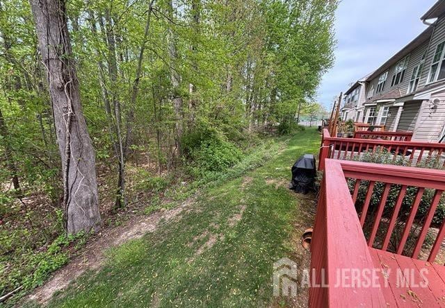 view of yard featuring a wooden deck