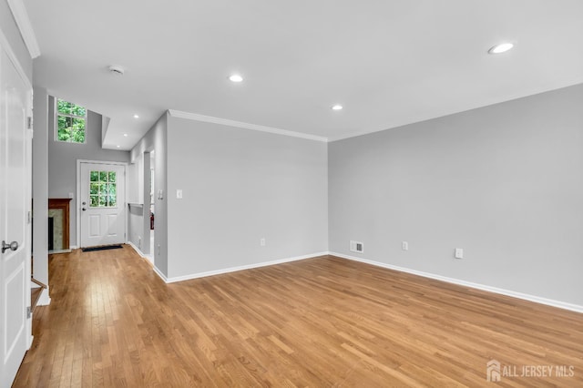 242 Hawthorne Rd, North Brunswick, NJ 08902 - empty room featuring light wood-style floors, recessed lighting, crown molding, and a smoke detector