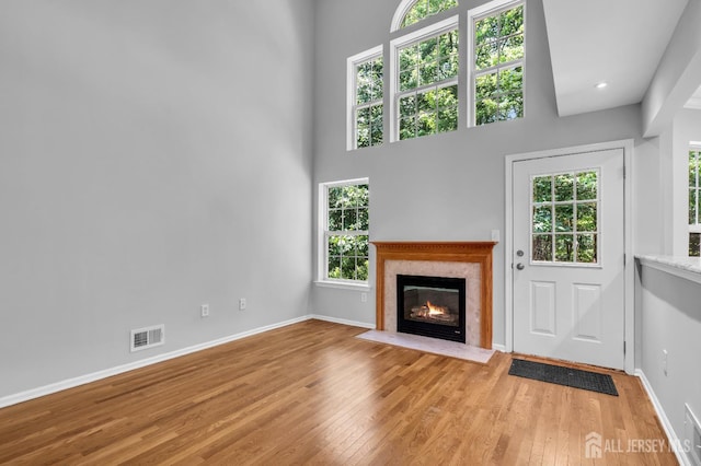 242 Hawthorne Rd, North Brunswick, NJ 08902 - unfurnished living room with hardwood / wood-style flooring, a high end fireplace, and recessed lighting