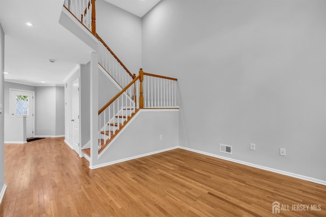 242 Hawthorne Rd, North Brunswick, NJ 08902 - entrance foyer featuring light wood-style floors, stairs, recessed lighting, and ornamental molding