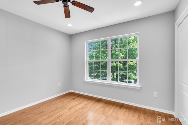 242 Hawthorne Rd, North Brunswick, NJ 08902 - empty room featuring healthy amount of natural light, ceiling fan, light wood finished floors, and recessed lighting