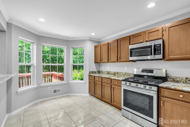 242 Hawthorne Rd, North Brunswick, NJ 08902 - kitchen with stainless steel appliances, brown cabinetry, light stone countertops, crown molding, and recessed lighting