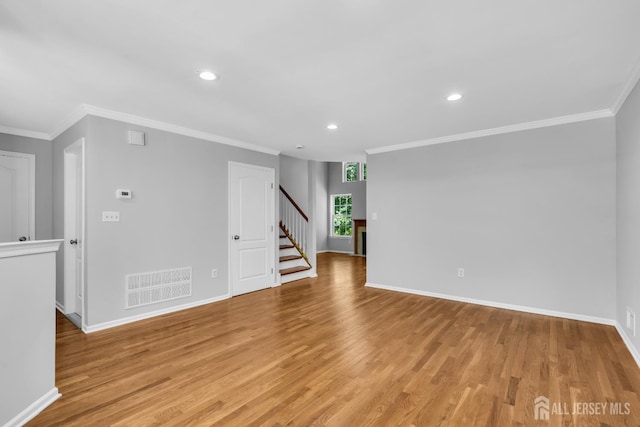242 Hawthorne Rd, North Brunswick, NJ 08902 - unfurnished room featuring stairs, recessed lighting, light wood-style floors, and crown molding