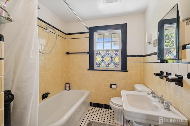 84 N Main St N, Cranbury, NJ 08512 - bathroom with shower / bath combo, tile walls, tile patterned flooring, and a wainscoted wall
