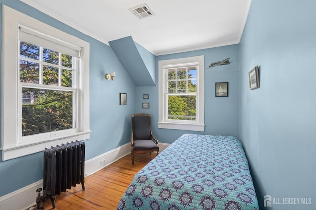 84 N Main St N, Cranbury, NJ 08512 - bedroom with radiator heating unit, multiple windows, crown molding, and wood finished floors