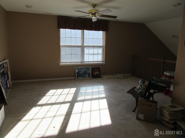 bonus room featuring lofted ceiling and ceiling fan