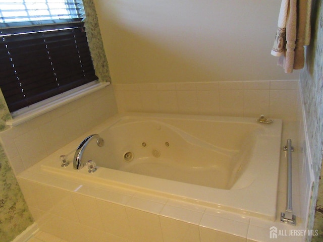 bathroom with tiled tub