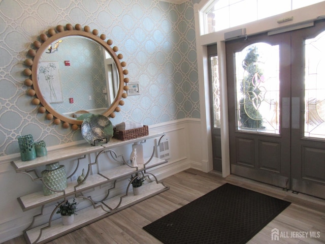 foyer entrance featuring light wood-type flooring and french doors