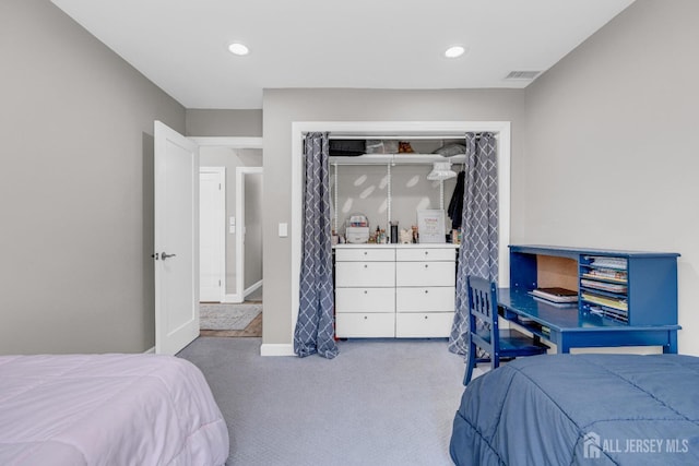 bedroom with carpet floors, recessed lighting, and a closet