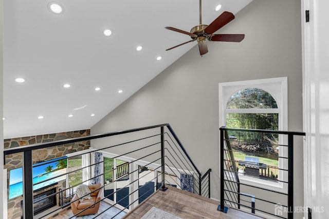 stairway featuring high vaulted ceiling, recessed lighting, and ceiling fan