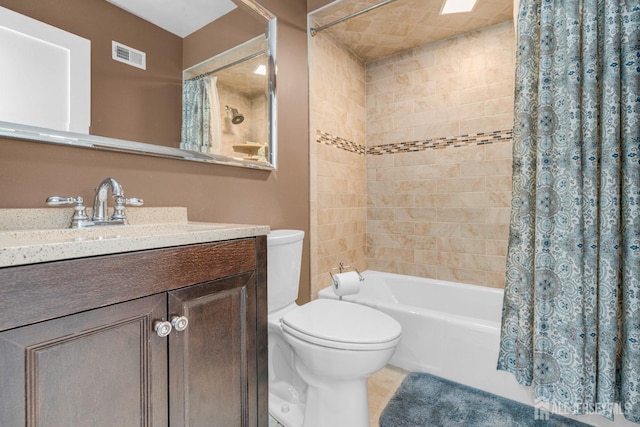 bathroom with shower / bath combination with curtain, toilet, vanity, and tile patterned flooring
