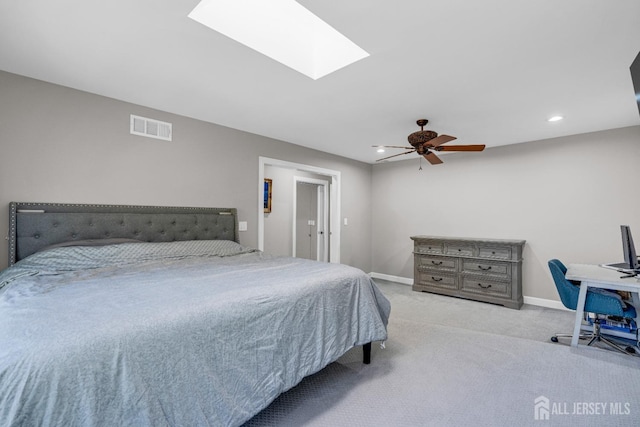 bedroom with carpet floors, a skylight, baseboards, recessed lighting, and ceiling fan
