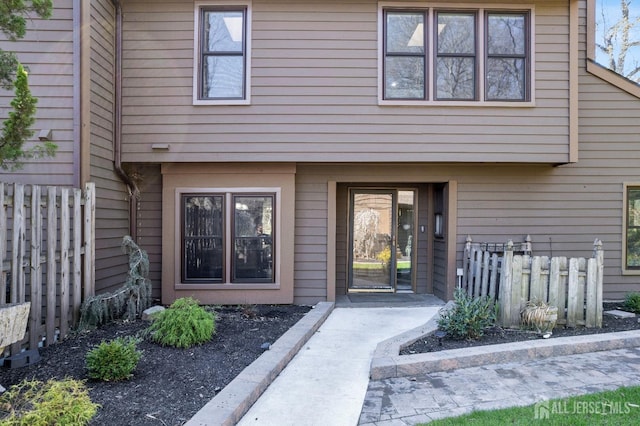 property entrance with fence