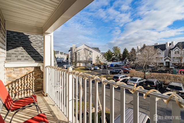 balcony with a residential view and covered porch