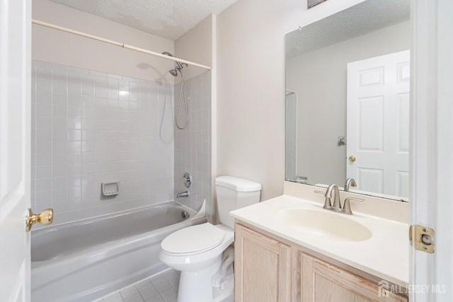 full bath featuring toilet, a textured ceiling,  shower combination, tile patterned flooring, and vanity