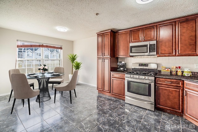 55 Inverness Dr, Edison, NJ 08820 - kitchen with stainless steel appliances, tasteful backsplash, a textured ceiling, baseboards, and dark marble finish floors