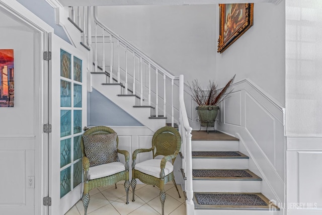 stairs with tile patterned flooring