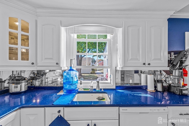 kitchen featuring dishwasher, white cabinetry, ornamental molding, and sink