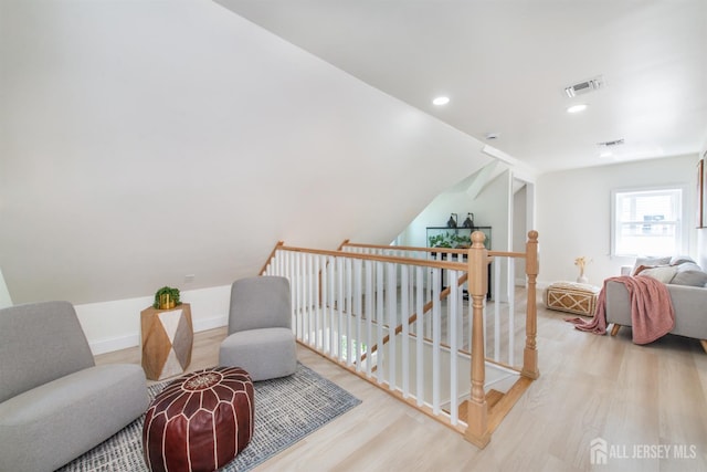 35 Evergreen Ave, Fords, NJ 08863 - sitting room with wood finished floors, an upstairs landing, vaulted ceiling, recessed lighting, and baseboards