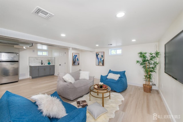 35 Evergreen Ave, Fords, NJ 08863 - living room with light wood-style flooring, recessed lighting, baseboards, and bar area