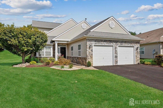 view of front facade with a garage and a front lawn