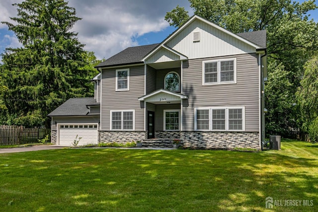 237 Varsity Ave, West Windsor, NJ 08540 - traditional home with stone siding, asphalt driveway, an attached garage, and a shingled roof