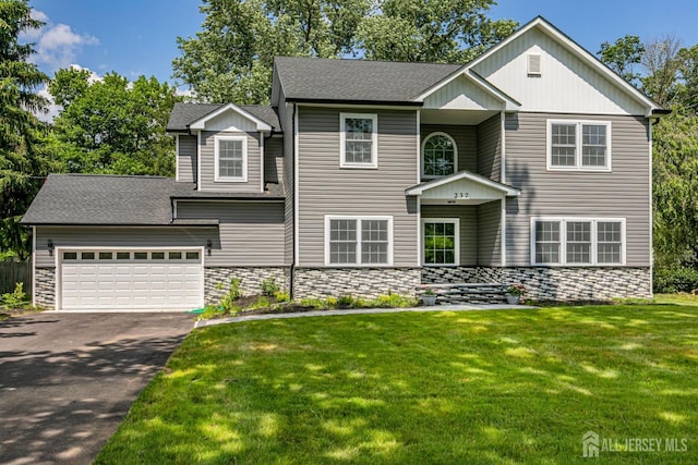 237 Varsity Ave, West Windsor, NJ 08540 - traditional-style house with asphalt driveway, stone siding, a front yard, a shingled roof, and an attached garage