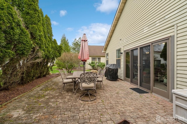 view of patio / terrace featuring outdoor dining area and grilling area