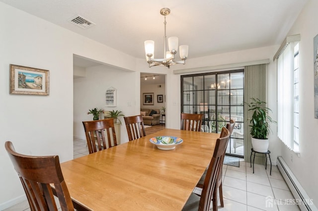 dining room featuring visible vents, light tile patterned floors, baseboards, a baseboard heating unit, and an inviting chandelier