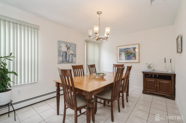 dining room featuring an inviting chandelier, light tile patterned floors, a baseboard radiator, and visible vents