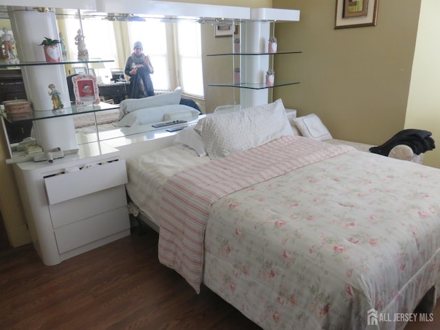 bedroom featuring wood finished floors