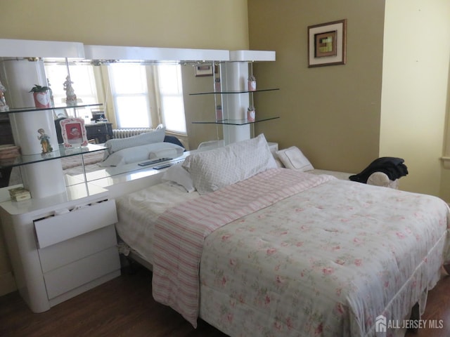 bedroom with wood finished floors