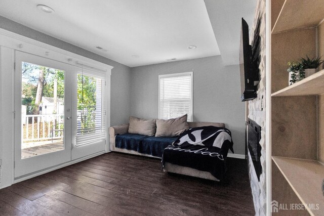 living room with dark hardwood / wood-style floors