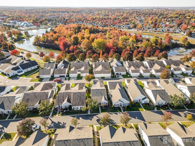 birds eye view of property featuring a water view and a residential view