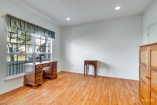 office space featuring light wood-style flooring, recessed lighting, and baseboards