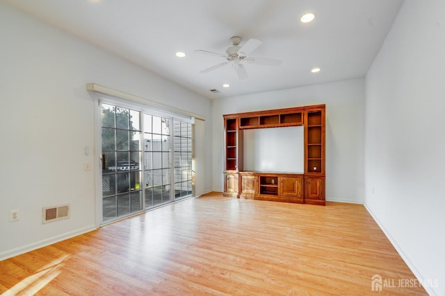 unfurnished living room with recessed lighting, visible vents, light wood finished floors, and baseboards