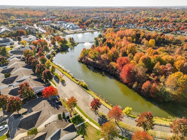 birds eye view of property with a water view and a residential view