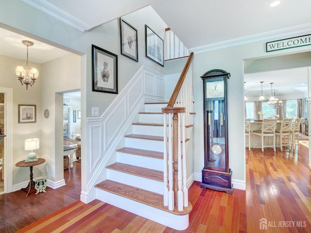 7 Willis Ct, East Brunswick, NJ 08816 - stairs featuring a chandelier, wood finished floors, and ornamental molding