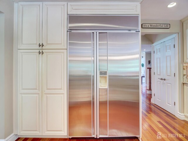 7 Willis Ct, East Brunswick, NJ 08816 - kitchen with built in fridge, light wood-type flooring, and recessed lighting