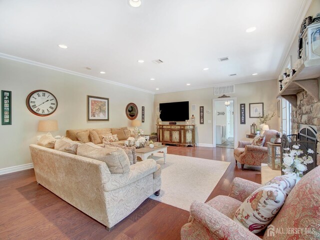 7 Willis Ct, East Brunswick, NJ 08816 - living area with a stone fireplace, wood finished floors, recessed lighting, and crown molding