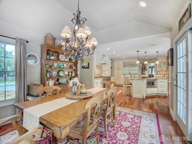 7 Willis Ct, East Brunswick, NJ 08816 - dining area featuring plenty of natural light, vaulted ceiling, wood finished floors, a chandelier, and recessed lighting