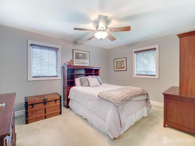 7 Willis Ct, East Brunswick, NJ 08816 - bedroom with multiple windows, light colored carpet, and ceiling fan