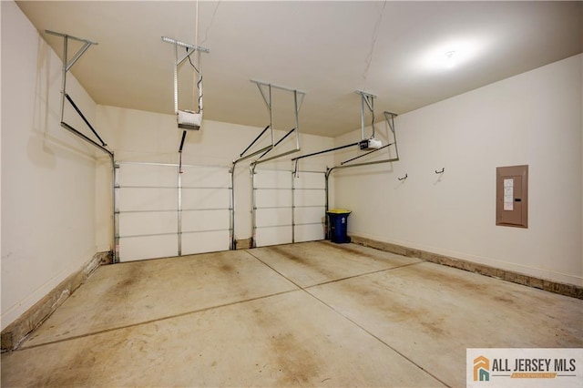 garage with electric panel, baseboards, and a garage door opener