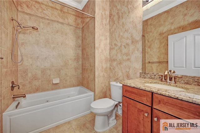 bathroom with tile patterned flooring, toilet, vanity, and shower / bathtub combination