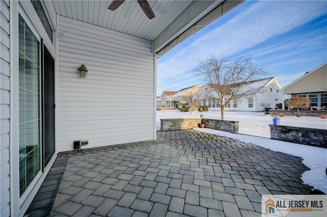 view of patio / terrace featuring a residential view and ceiling fan