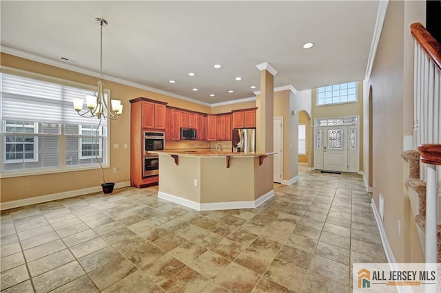 kitchen with crown molding, a chandelier, a breakfast bar area, arched walkways, and stainless steel appliances